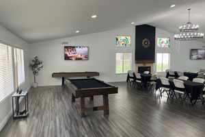 a living room filled with furniture and a flat screen tv