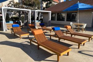 a group of lawn chairs sitting on top of a picnic table