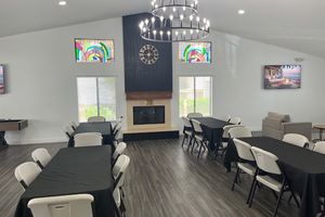 a living room filled with furniture and a flat screen tv