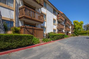 community building with green shrubs