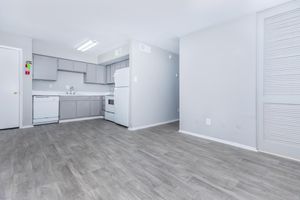 a kitchen with a building in the background