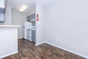 a kitchen with a sink and a refrigerator