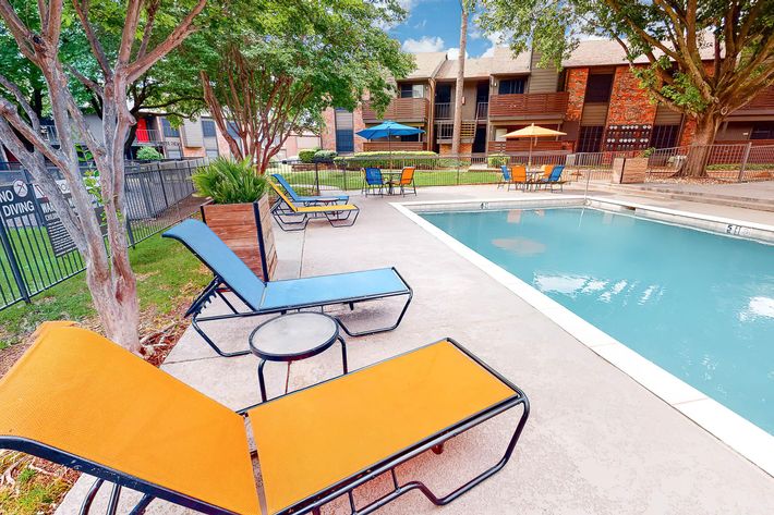 a chair sitting in front of a pool