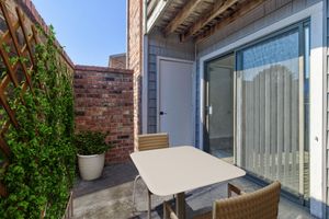 a chair sitting in front of a building