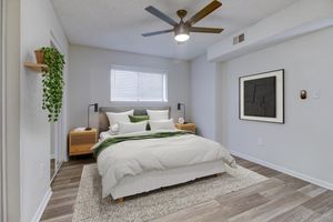 a bedroom with a large bed in a room