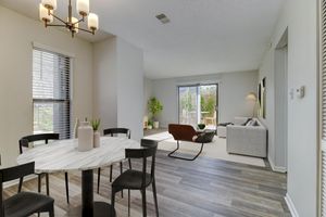 a living room filled with furniture and a large window