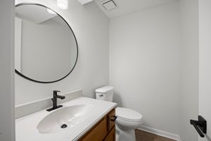 a room with a sink and a mirror