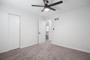 a bedroom with a large mirror