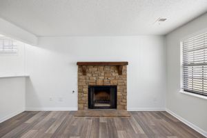 a living room filled with furniture and a fire place