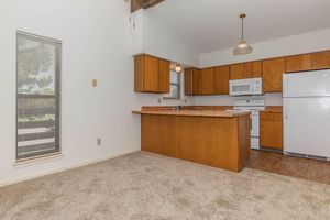 a kitchen with a wooden floor