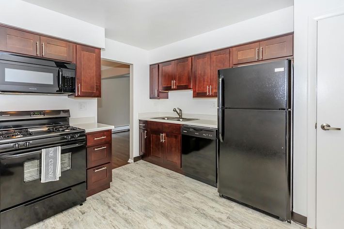 a large kitchen with stainless steel appliances