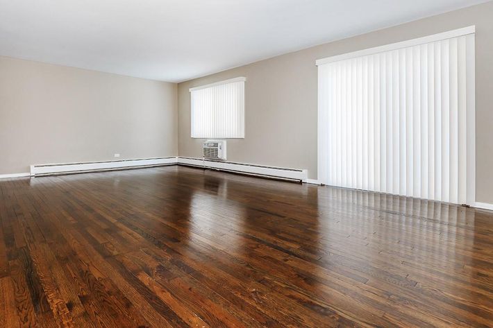 a large empty room with a wooden floor