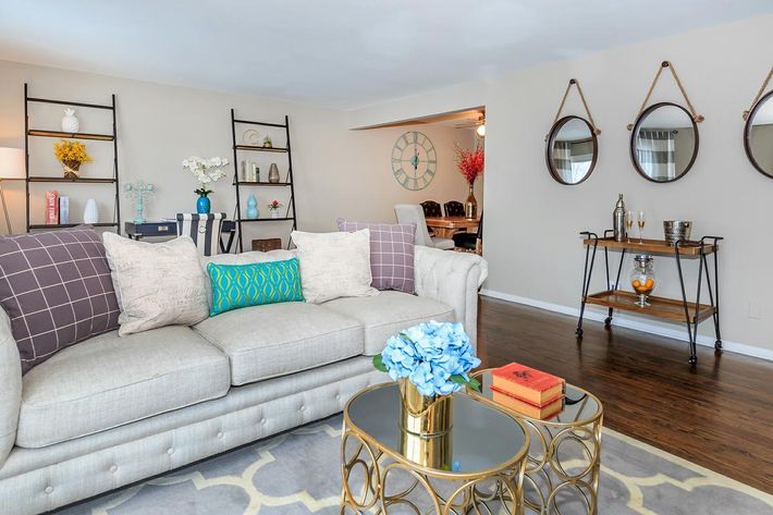 a living room filled with furniture and decor