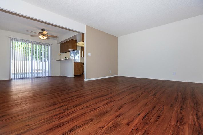 Living room and dining room with wooden floors