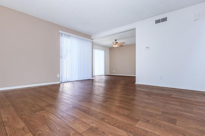 Dining room and living room with wooden floors