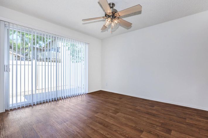 Dining room with wooden floors and glass sliding doors