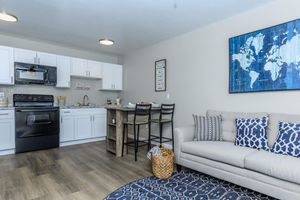 a living room filled with furniture and a tv