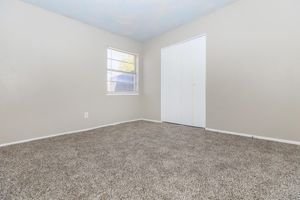 a bedroom with a large window