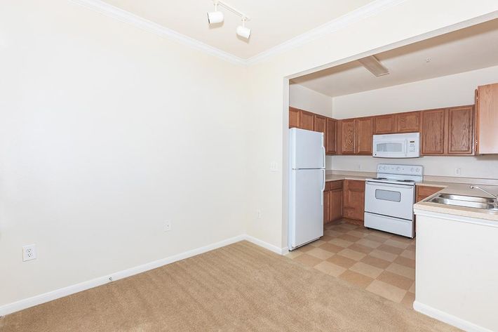 a large white refrigerator in a kitchen