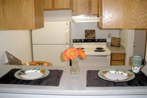 a kitchen with a plate of food on a table