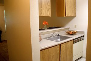 a kitchen with a sink and a microwave