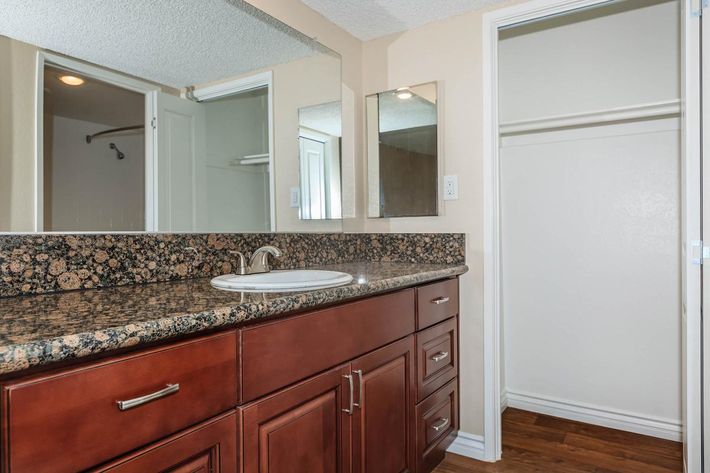 a kitchen with a sink and a window