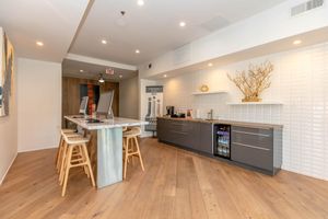 a kitchen with a hard wood floor