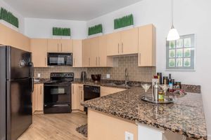 a modern kitchen with stainless steel appliances