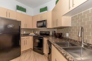 a modern kitchen with stainless steel appliances