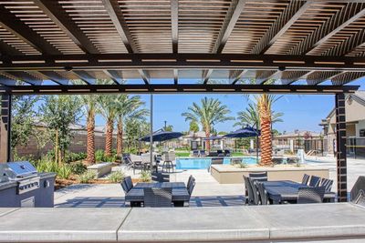 The community pool with a stainless steel barbecue