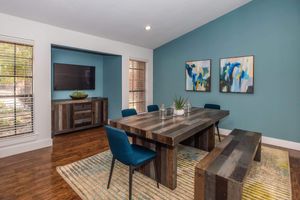 a living room filled with furniture and a large window