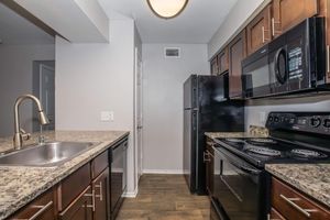 a large kitchen with stainless steel appliances