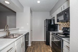 a modern kitchen with stainless steel appliances