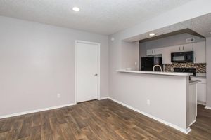 a kitchen with a wood floor