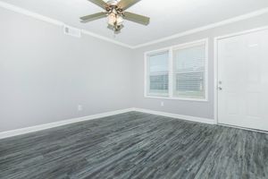 a bedroom with a large window