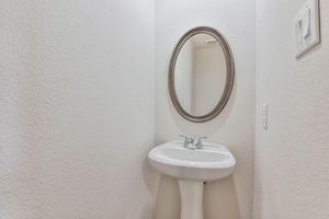 a close up of a sink and a mirror
