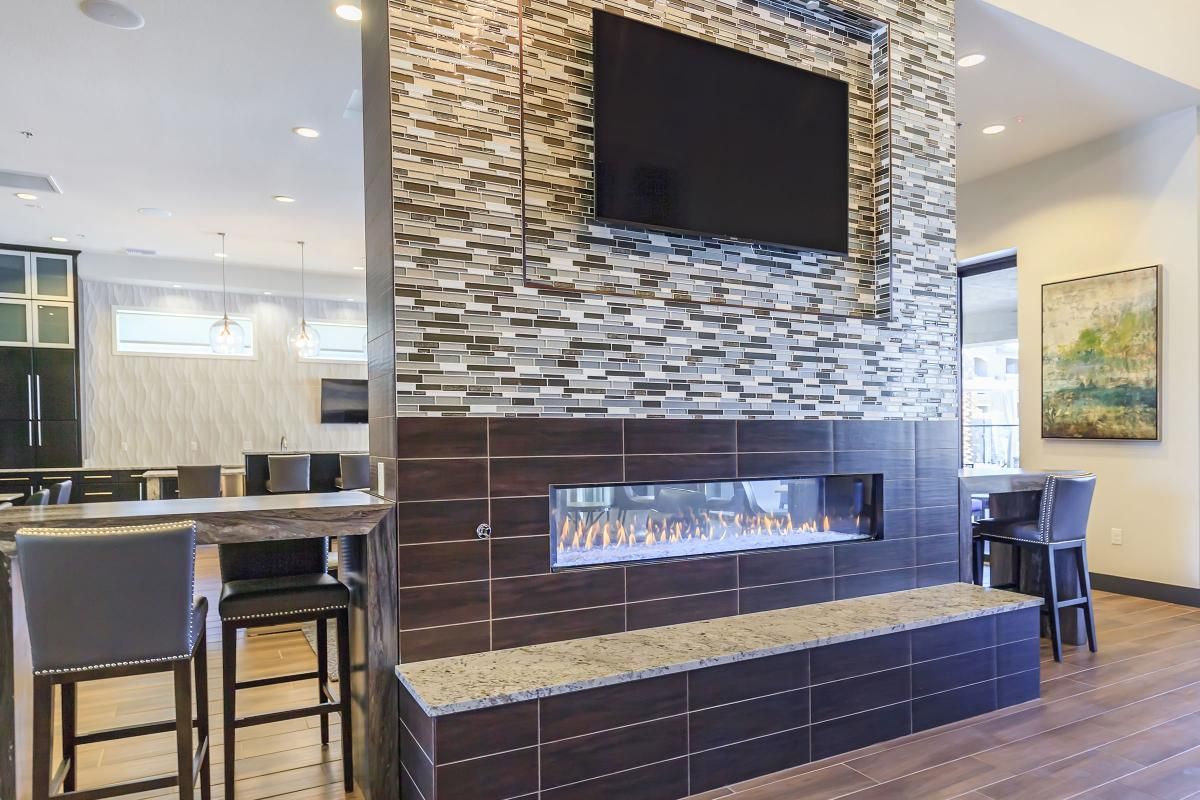 Dual Sided Fireplace with Flat Screen TV at Level 25 at Durango