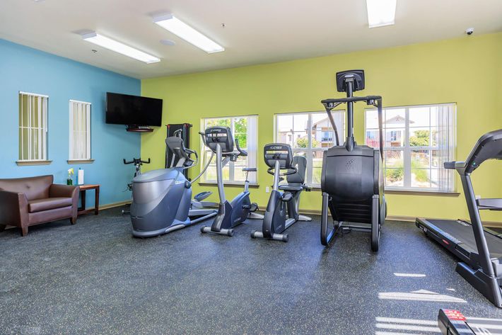 FITNESS CENTER FEATURING FREE WEIGHTS AND FULL WALLED MIRROR
