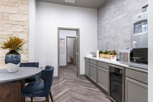 community kitchen with grey cabinets
