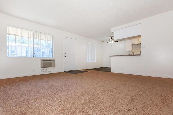 Vacant carpeted living room 