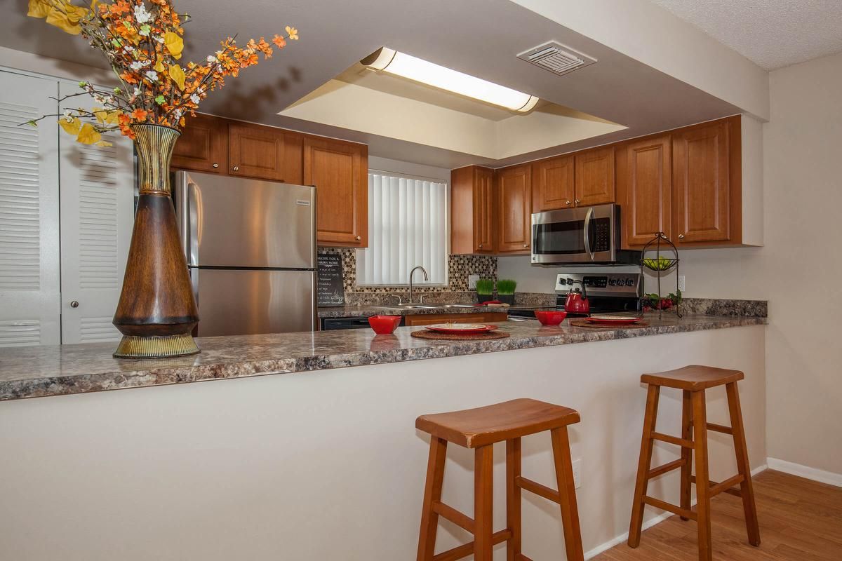 CHEF'S KITCHEN AVAILABLE WITH A BREAKFAST BAR AND PANTRY