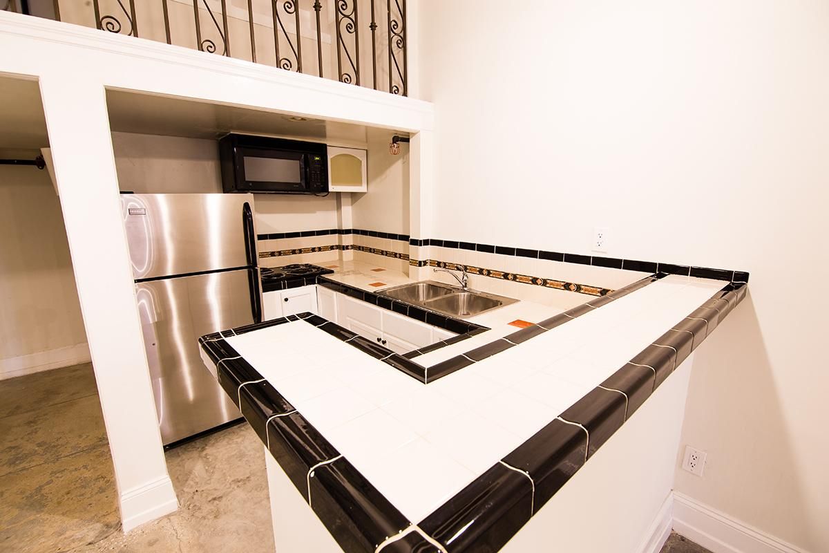 Gourmet kitchen with stainless steel refrigerator at Ancelle