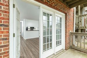 a door with a window in a brick building
