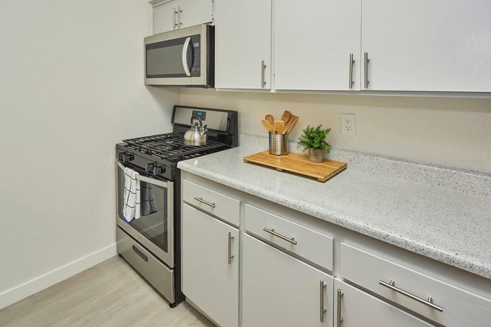 a kitchen with a sink and a microwave