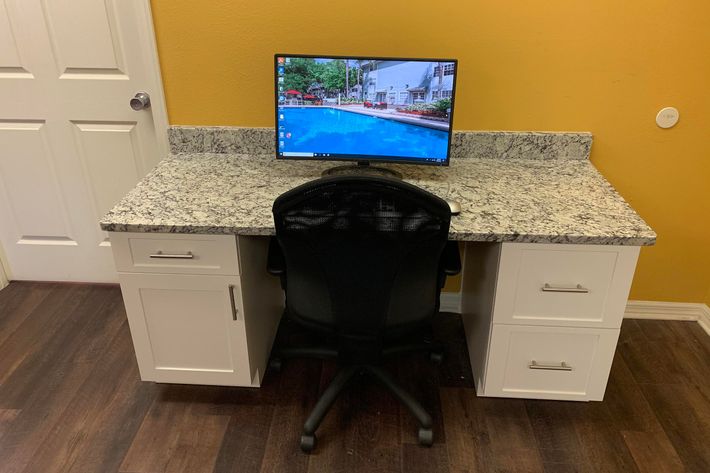 a desk with a computer