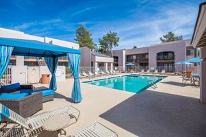 Poolside lounge area with sling furniture at Azul Apartments in Phoenix, Arizona