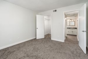 Bedroom with walk-in closet at Azul Apartments in Phoenix, Arizona