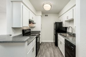 Kitchen equipped with black appliances at Azul Apartments in Phoenix, Arizona