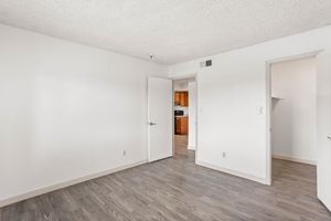 Large spacious white bedroom and walk in closet