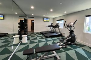 Modern fitness center with work out equipment and machines